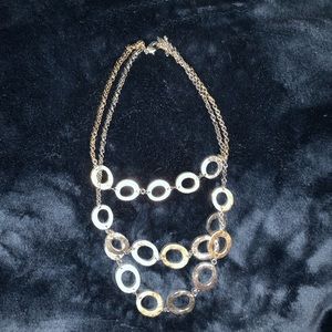 Triple graduated strands of gold and silver rings